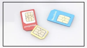 Person holding multiple SIM cards under the DoT New SIM Rule for mobile connection limits.
