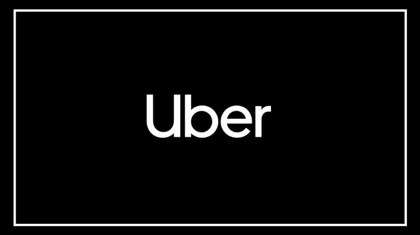 Uber driver riding a motorcycle on an Indian city road